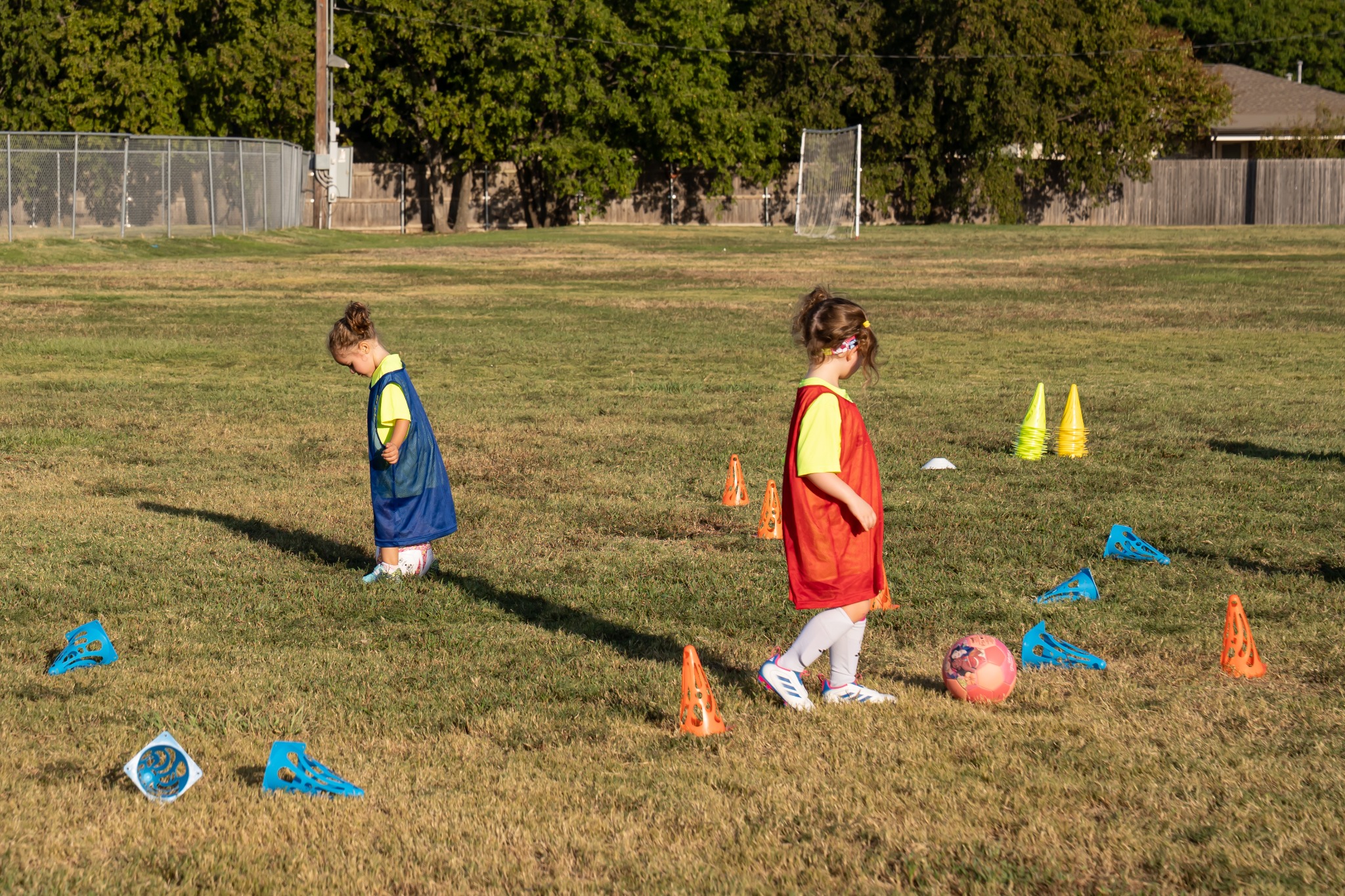 Children playing soccer outdoors
